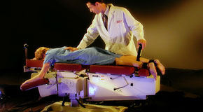 This is a picture of Cox Technic chiropratic spinal manipulation as performed at Dr. Hoang's Chiropractic Clinic.