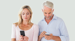 Montreal couple using smartphones